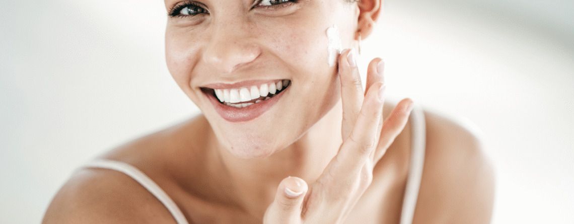 A girl applying retinol